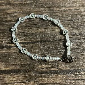 Beaded bracelet with clear and flower beads for size small/medium wrist. 6.5 in.